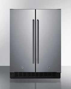 a stainless steel double door refrigerator on a gray countertop with black trimmings