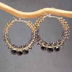 Hammered hoops with black spinel and bronze pearls Cleopatra 132 Adjustable Black Beaded Hoop Jewelry, Elegant Bronze Jewelry With Faceted Beads, Black Hand-wrapped Metal Jewelry, Hand Wrapped Black Metal Jewelry, Hand-wrapped Black Metal Jewelry, Elegant Round Hematite Jewelry, Handmade Black Hoop Jewelry, Black Hand Wrapped Round Jewelry, Elegant Gold Hematite Jewelry