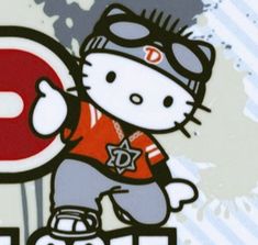 the hello kitty is holding up a stop sign