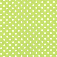 a green background with white polka dots