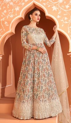 COLOR : Cream Beige FABRIC : Gown - Pure Georgette, Dupatta - Net WORK : Resham Embroidery, Sequins, Digital Floral Print, Lace BorderOCCASION : Wedding, Reception, Mehendi, Engagement, Party Wear, Festival READY-TO-WEAR : No STITCHING : Available as semi-stitched fabric, can be stitched using standard size option (+$20). Note: There might be a slight color variation due to lighting and flash used during photoshoot. The bright shade seen is the best closer view of fabric's color. Indian Wedding Outfits Guest For Women, Indian Wedding Outfits Guest, Floral Print Anarkali, Georgette Anarkali Suits, Georgette Anarkali, Gown With Dupatta, Long Anarkali, Lehenga Gown, Gown Suit