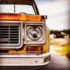 the front end of an old rusty truck