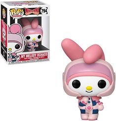 the pop vinyl figurine is wearing a pink outfit and holding a baby doll