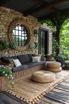 an outdoor living area with wicker furniture and mirrors