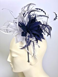 Kentucky Derby Navy Blue and Gray Fascinatorheadband created with a handmade feather motif in a wide range of colors. Please choose from the drop down menu.. It has then been mounted on a hand band for ease of wear. Fits all head sizes as it perches on the side of the head and on the top. COLORS AVAILABLE: black, navy blue, gray, red, pastel pink, fuchsia, royal blue, ivory, mint, pastel blue, off white, yellow, dusty rose etc This hat/fascinator will never ever fail to get you compliments! Ship Blue Feather Trim Headpiece For Wedding, Adjustable Blue Fascinator With Feather Trim, Blue Wedding Headpiece With Feather Trim, Blue Feathered Wedding Fascinator, Blue Feathered Headband Fascinator, Elegant Blue Headpiece With Feather Trim, Adjustable Blue Feather Headpiece, Adjustable Blue Feathered Headpiece, Grey Fascinator