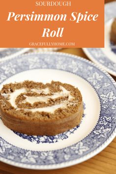 a piece of cake sitting on top of a blue and white plate with the words, sourdough persimmon spice roll