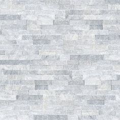 a white brick wall textured with grey and gray marble tiles for walls or flooring