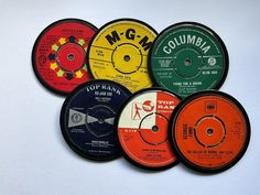 six different colored records on a white surface with the word columbia written in black and red