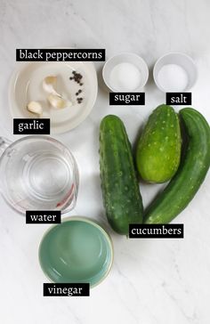 cucumbers and other ingredients on a white counter top with words describing the names