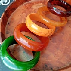 Elevate your style with this unique set of 5 Vintage Bakelite Phenolic Resin Bracelets 💫🌟 Add a touch of retro charm to your outfit! #VintageJewelry #BakeliteBracelets #VintageFashion #UniqueFinds #StatementJewelry  #Bakelite Cake Makeover, Garden Tools Design, Tools Design, Bakelite Bracelets, 1960s Jewelry, Bakelite Jewelry, Bakelite Bangles, Resin Bracelet, Family Jewels