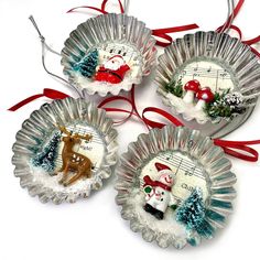 three christmas ornaments with musical notes on them