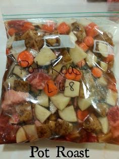 a plastic bag filled with potatoes and carrots