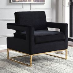 a black chair sitting on top of a rug