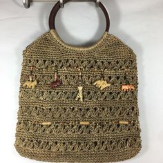 St Johns Bay Woven Straw Handbag With Animal Bead Detail. Leather Round Handles. Inside Zipper Pocket. Brand New Beaded Brown Shoulder Bag For Vacation, Beaded Brown Shoulder Bag For The Beach, Summer Beaded Brown Shoulder Bag, Summer Brown Beaded Shoulder Bag, Casual Beaded Rectangular Shoulder Bag, Vacation Beaded Beige Shoulder Bag, Summer Beach Crochet Bag With Beaded Detail, Summer Beach Crochet Bag With Beads, Beaded Crochet Beach Bag For Summer