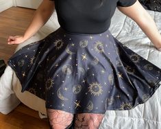 Get ready for the warm weather with this cute celestial-themed witchy skater skirt. This was designed because I've been frustrated with how hard it is to find cute, witchy clothing, especially dresses and skirts This very comfty skirt goes up to plus size 3X! Model is 5'9 / 210lbs and is wearing an XL Shipping Delays It can take up to 2-4 weeks for delivery due to shipping delays and staffing shortages at our printing partners.  * 82% polyester, 18% spandex * Fabric weight: 6.78 oz/yd² (230 g/m weight may vary by 5% * Smooth and elastic fabric * Mid-thigh length flared skirt * Elastic waistline * Overlock seams, coverstitch hemline Witchy Skirt For Costume Party, Witchy Fitted Skirt For Costume Party, Witchy Fitted Skirt For Halloween, Witchy Fitted Skirt For Cosplay, Renesance Fair, Fairy Grunge Fitted Mini Skirt For Summer, Witchcore Skirts, Celestial Pleated Skirt, Witchy Skirt