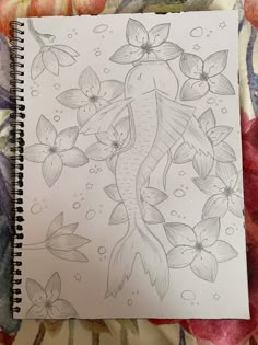 a drawing of a fish with flowers on it