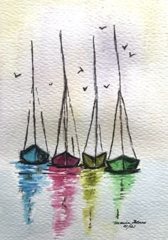 three small boats floating on top of water