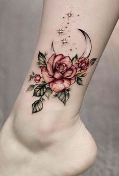 a woman's foot with roses and crescent tattoo on the left side of her leg