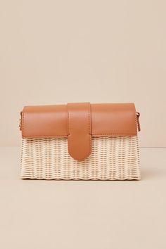 Everyone will be in awe of your elevated aesthetic when they spot you carrying the Moda Luxe Enviable Taste Brown and Ivory Woven Crossbody Bag! This chic bag has a structured woven silhouette with a rectangular design and a flat bottom. Sleek, faux leather top flap has a magentic clasp closure that opens to reveal a roomy interior with a zippered pouch and a sidewall pocket. Style it with the attachable shoulder strap or handbag strap, so you can always match your look! Lined. Bag Measures 10.