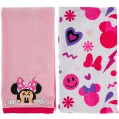 two towels with mickey and minnie mouse designs on them, one is pink and the other is white