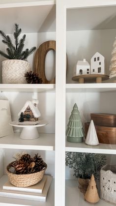 shelves filled with christmas decorations and pine cones