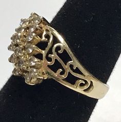 Stunning 14K Yellow Gold .95 CTW Diamond Cluster Filagree Ring Sz 6 Very pretty ring!! The mounting is solid 14K yellow gold with 19 round diamonds making up three rows. Each diamond is .05ct total of .95ctw! Ring weighs 4.5 grams of 14k yellow gold! Will ship in a gift box fully insured:) Gold Cluster Ring With Vs Clarity, Gold Diamond Cluster Ring Stamped 14k, Gold Collectible Cluster Ring, Collectible Gold Rings With Diamond Accents, Antique Gold Cluster Diamond Ring, Gold Cluster Ring Collectible Fine Jewelry, Gold Cluster Ring Fine Jewelry Collectible, Gold Cluster Rings With Diamond Cut, Collectible Cluster Ring With Diamond Accents