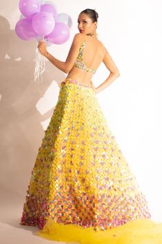 Yellow can can attached lehenga with sequin and pearl embellished floral motifs. Comes with matching padded blouse and dupatta.
Components: 3
Pattern: Embellished
Type Of Work: Sequin, Pearl
Neckline: V-neck
Sleeve Type: Sleeveless
Fabric: Net
Color: Yellow
Other Details: 
Attached lining
Lehenga Length: 46 inches
Weight: 7.5 kgs
Closure:
Lehenga: Side drawstring
Blouse: Back hook
Occasion: Sangeet,Cocktail - Aza Fashions Multicolor Hand Embellished Lehenga For Party, Multicolor Hand-embellished Lehenga For Party, Multicolor Hand Embellished Choli For Parties, Hand Embellished Multicolor Choli For Party, Party Multicolor Hand Embellished Lehenga, Hand Embellished Multicolor Party Choli, Glamorous Mirror Work Lehenga For Celebration, Glamorous Lehenga With Mirror Work For Celebration, Multicolor Sequined Choli For Wedding