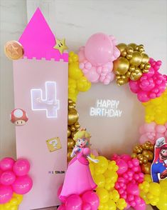 a birthday card with balloons and mario bros characters on the front, along with other decorations