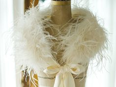 a mannequin with white feathers on it