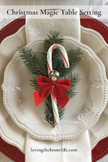 a white plate topped with candy canes and a christmas decoration on top of it