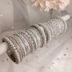 Large stacks of stunning silver and white pearl bangles finished with our delicate daisy bangles in the middle for that glam look. Ready to Ship with gift boxing. Pearl Bangles, Fancy Jewellery Designs, Asian Jewelry, Pearl Bangle, Bangles Indian, Glam Look