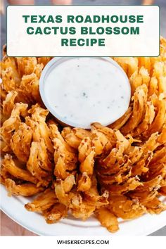 a white plate topped with fried food next to a bowl of ranch dressing and the words texas roadhouse cactus blossom recipe