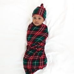 Infant laying on a blanket swaddled in a Fireside Plaid Swaddle & Hat Set Family Holiday Cards, Holiday Baby, Box Making, Baby Gown, Holiday Style, Fall Favorites, Family Holiday, Holiday Collection, Burp Cloths