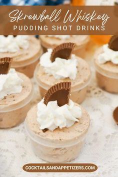 several cupcakes with whipped cream and chocolate on top are sitting in plastic cups