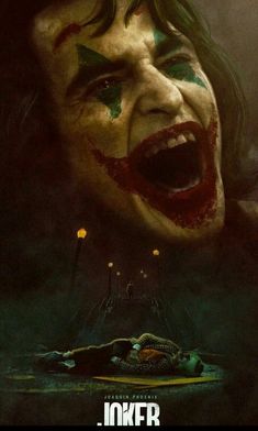 the joker movie poster with his face painted in green and red, as if he is screaming