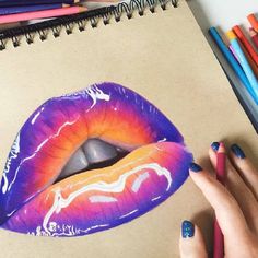 a woman's hand is holding a pencil drawing of a purple and orange lip