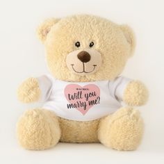 a brown teddy bear wearing a white shirt