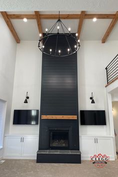 an empty living room with a fireplace and entertainment center