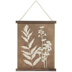 a brown wall hanging with white flowers on it