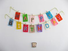 a happy birthday banner hanging on a wall