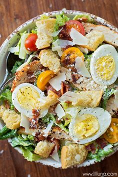 a salad with hard boiled eggs and croutons