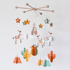 a mobile with animals and stars hanging from it