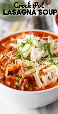 a bowl of crock pot lasagna soup with cheese and parmesan