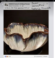 a white and brown bowl sitting on top of a black table next to an instagram page