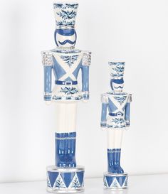 two blue and white nutcrackers are standing next to each other