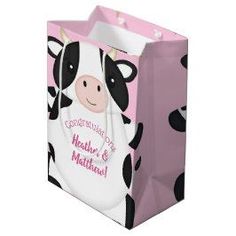 a pink bag with a cow on it