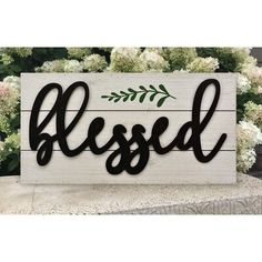 a wooden sign that says,'blessed '