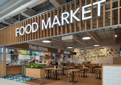 a food market with tables, chairs and lights on the front wall is shown in this rendering