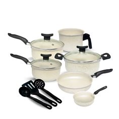 an assortment of pots and pans on a white background