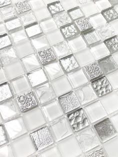 a white and silver glass tile wall